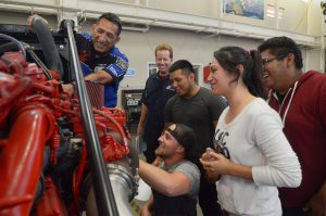 Students engaged in a hands on lesson in Diesel Technology class