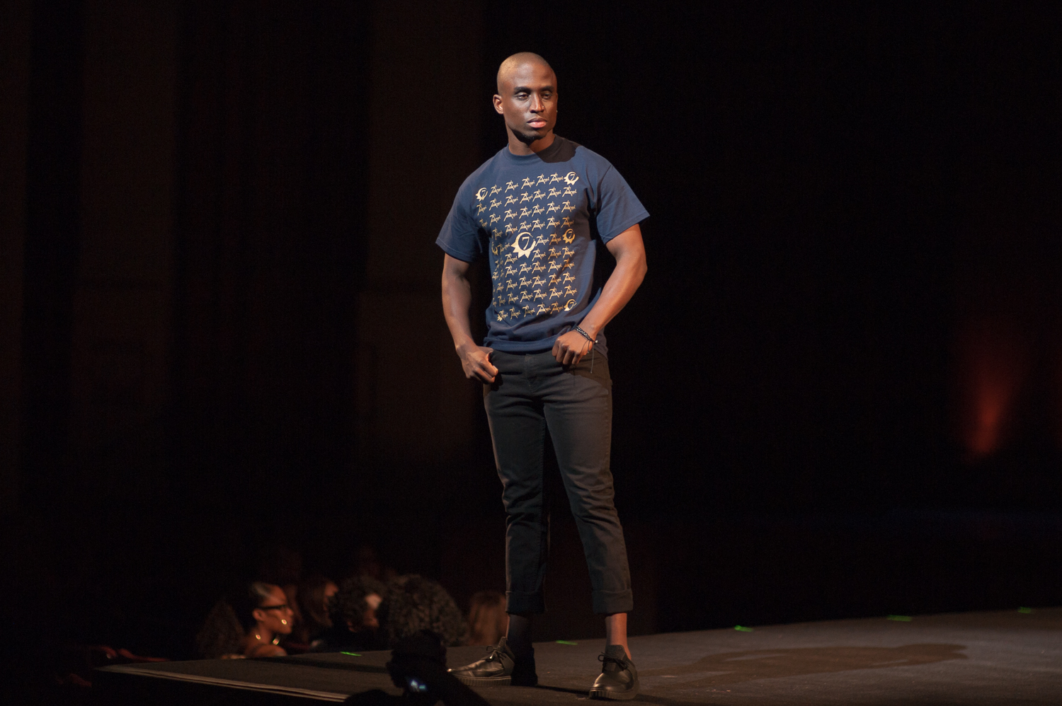 Male model posing on runway
