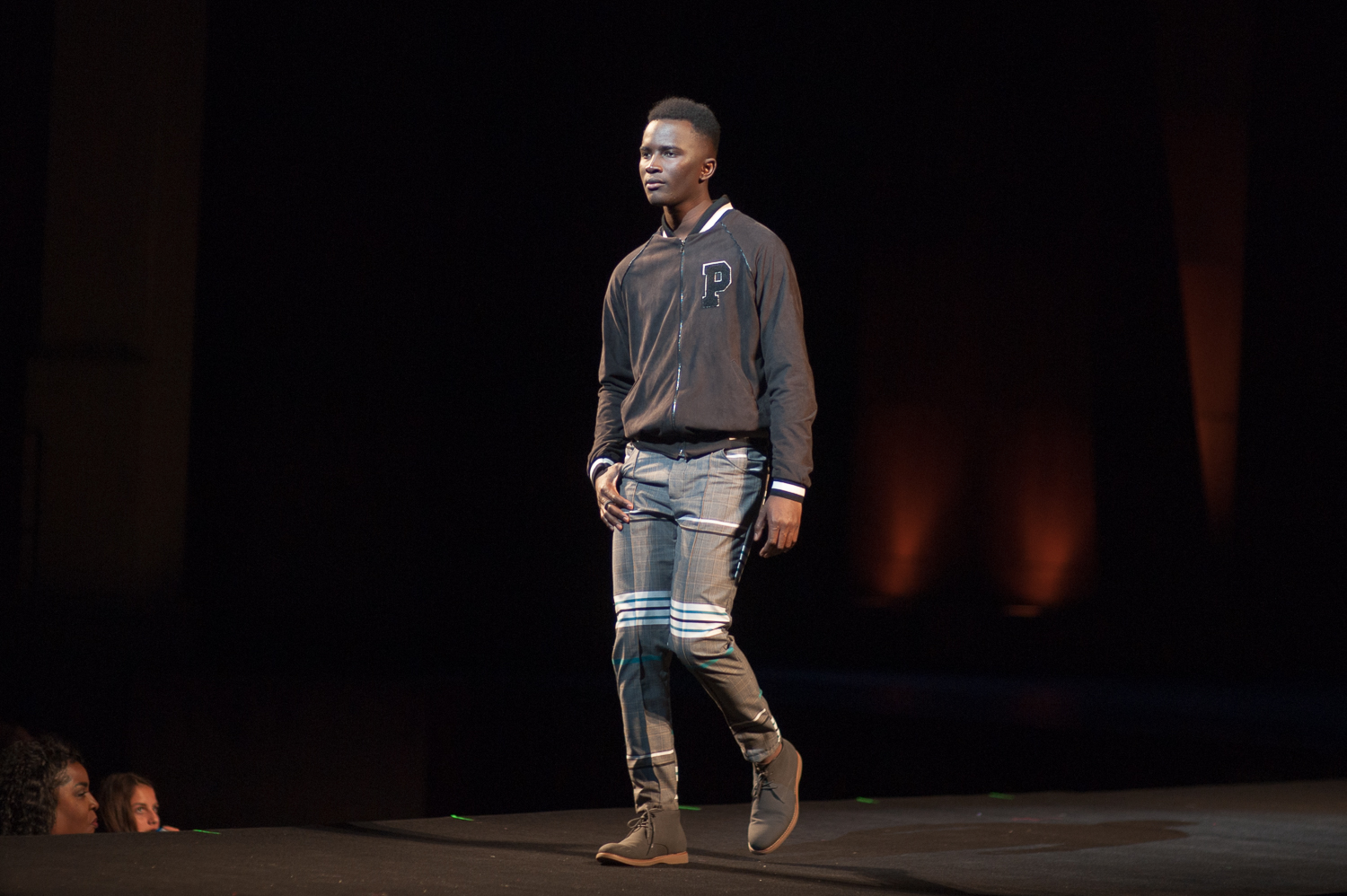 Male model walking on runway