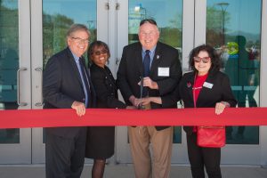 Palomar leadership cutting a red ribbon at the Rancho Bernardo campus