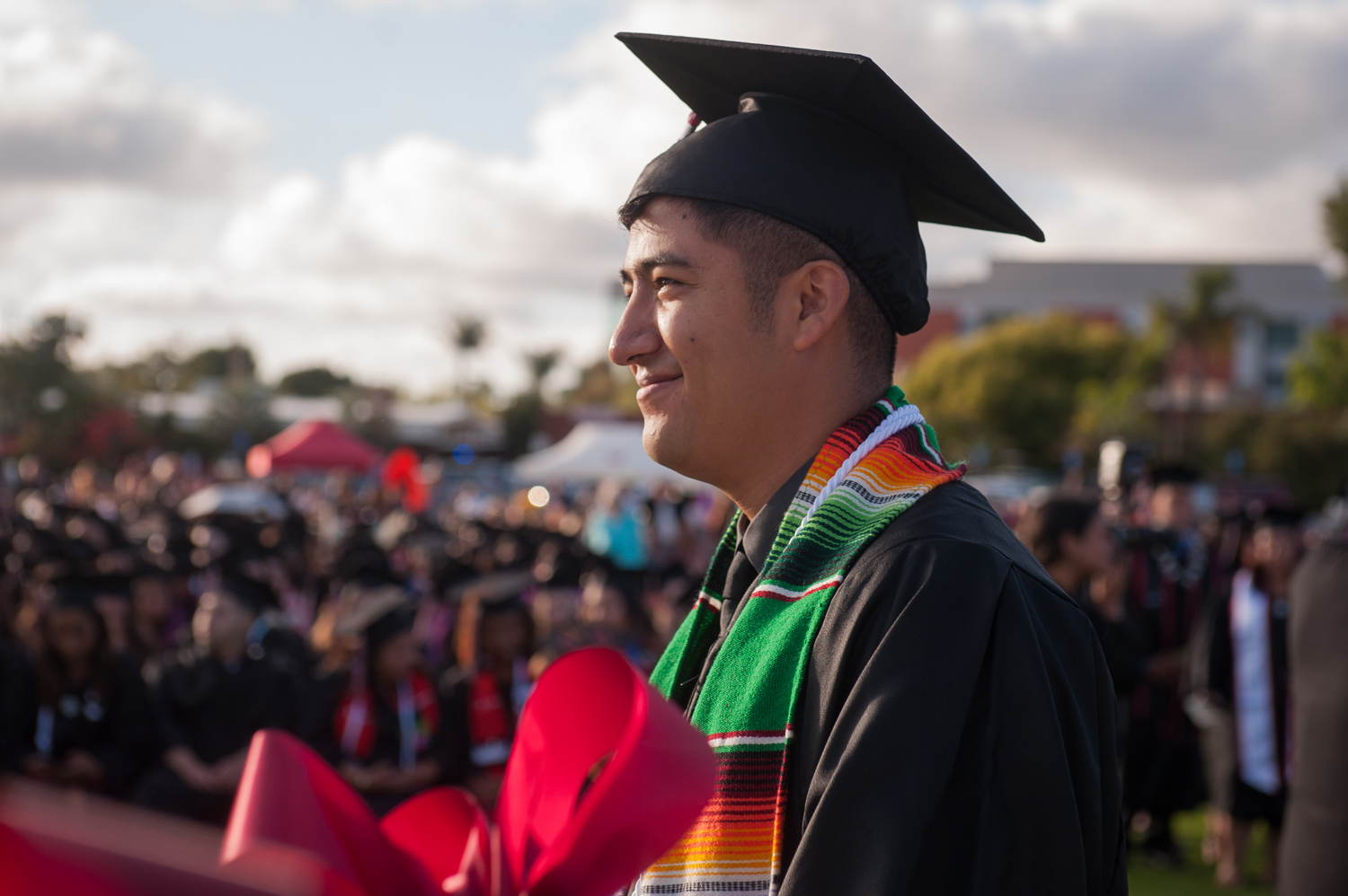 Graduate in cap and gown at commencement ceremony
