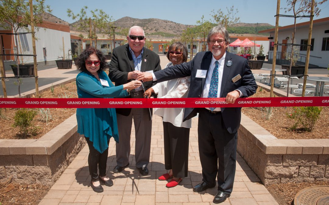 Palomar leadership cutting a red ribbon at the grand opening of the Fallbrook Education Center