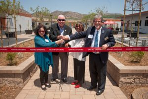 Palomar leadership cutting a red ribbon at the grand opening of the Fallbrook Education Center