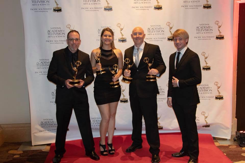 PCTV staff at the Emmy Awards ceremony red carpet holding Emmy awards