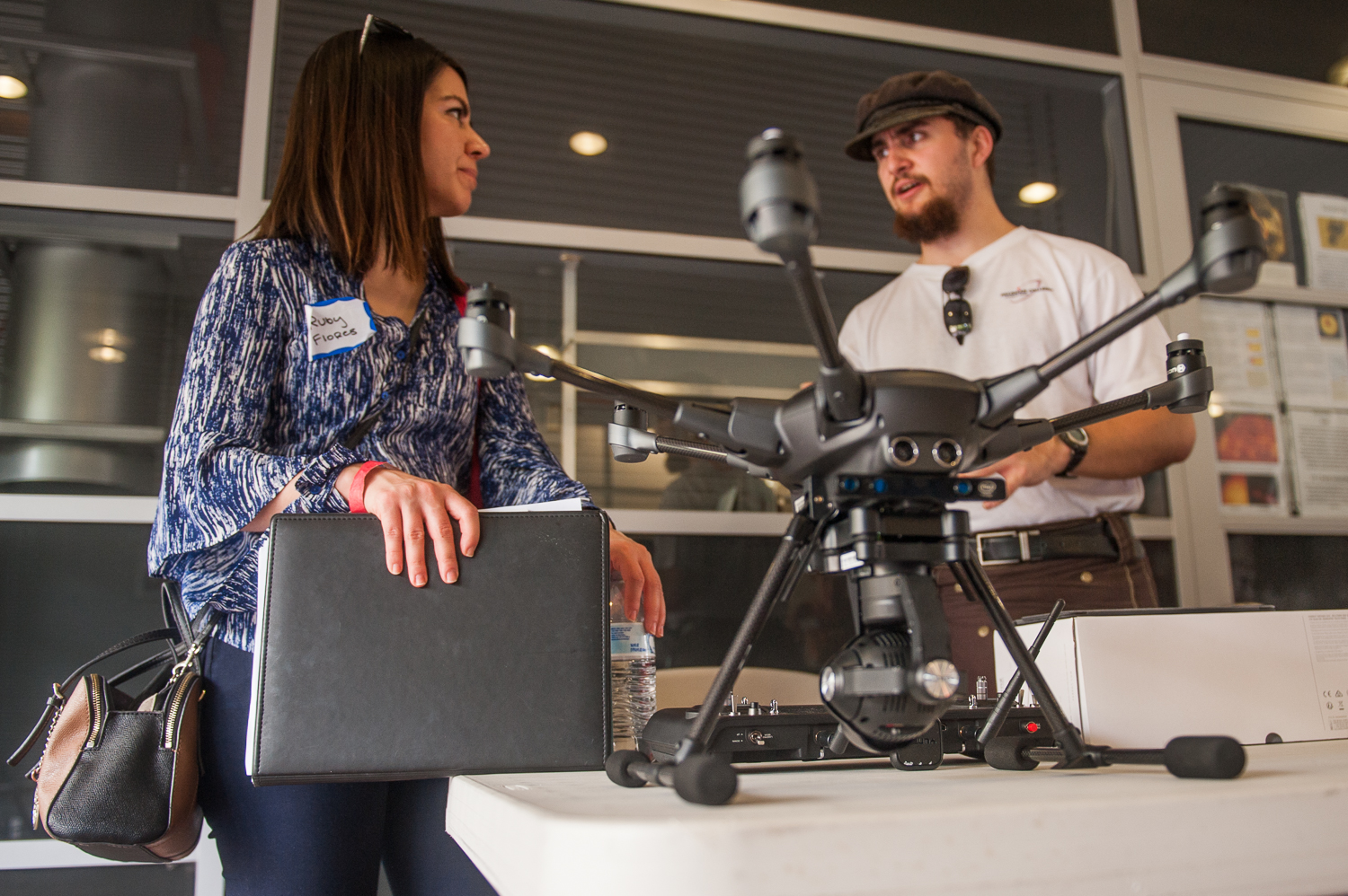 Ruby Flores talking to Neil McDowell-Horn at Palomar College.