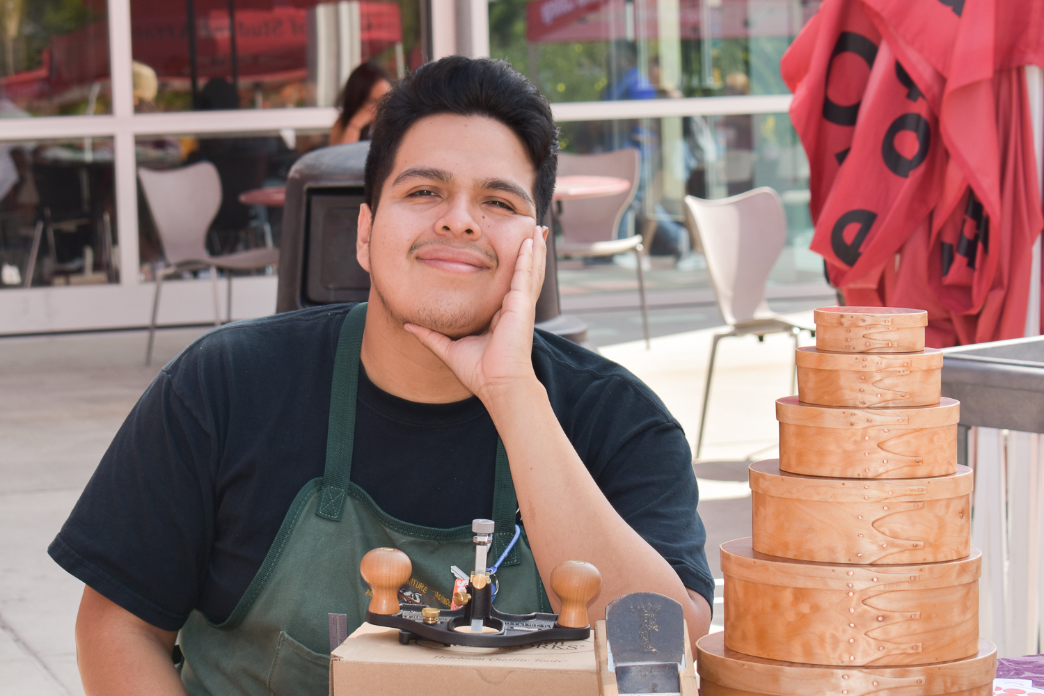 Palomar student showcasing his woodwork project