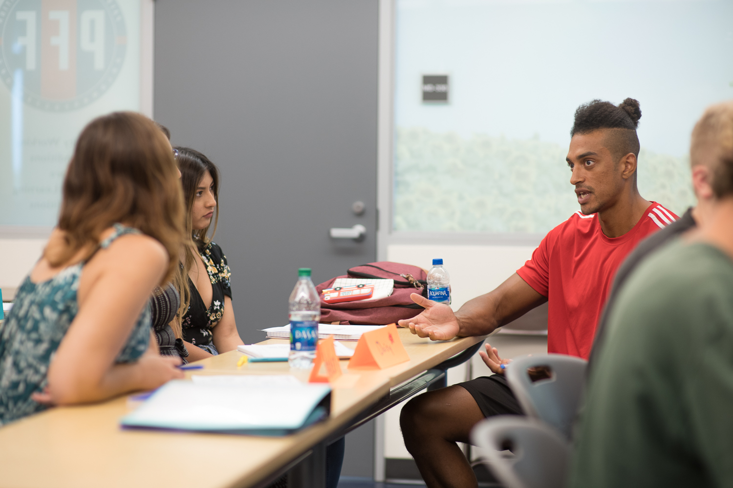 Students engaged in a group conversation in class