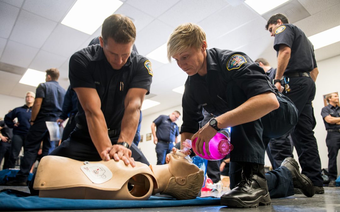 EME students practicing CPR on plastic dummy
