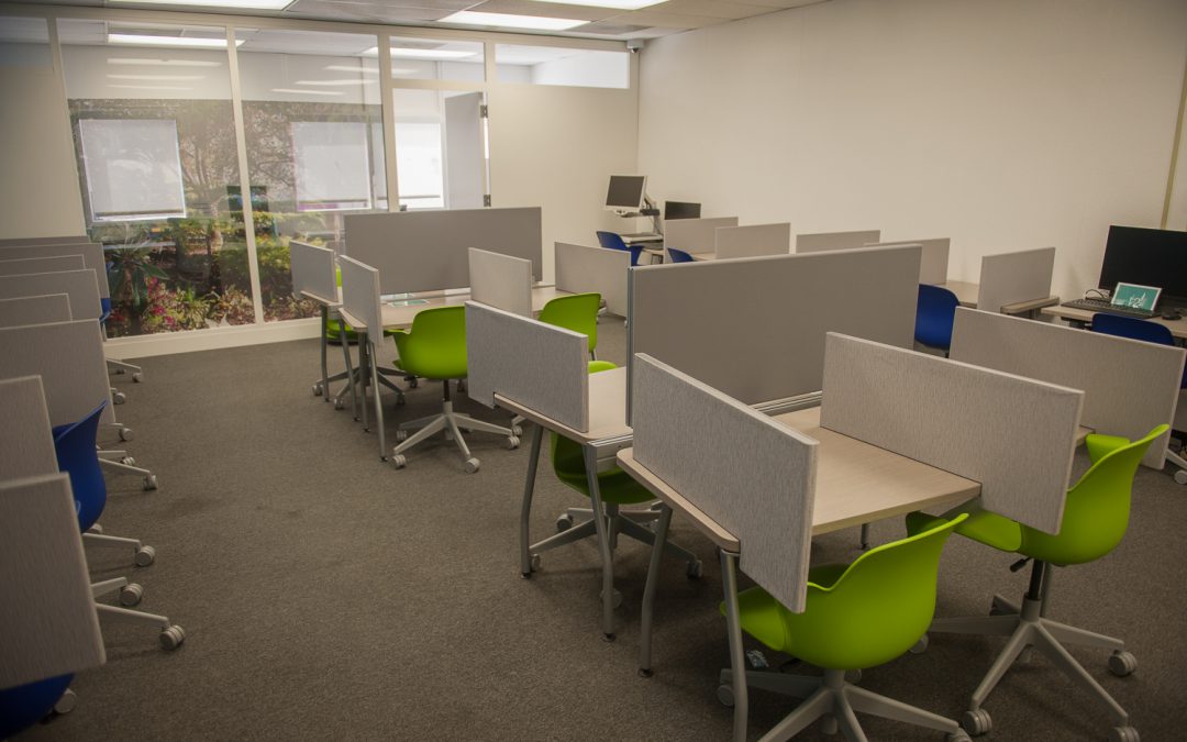 Testing center room with desks and chairs