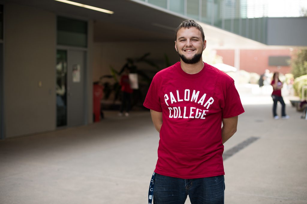Palomar graduate Matt Baugh wearing a red Palomar college shirt