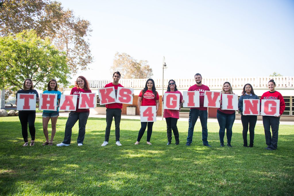 Students red holding letters spelling Thanks 4 Giving