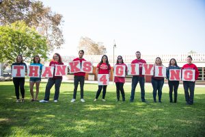 Students red holding letters spelling Thanks 4 Giving