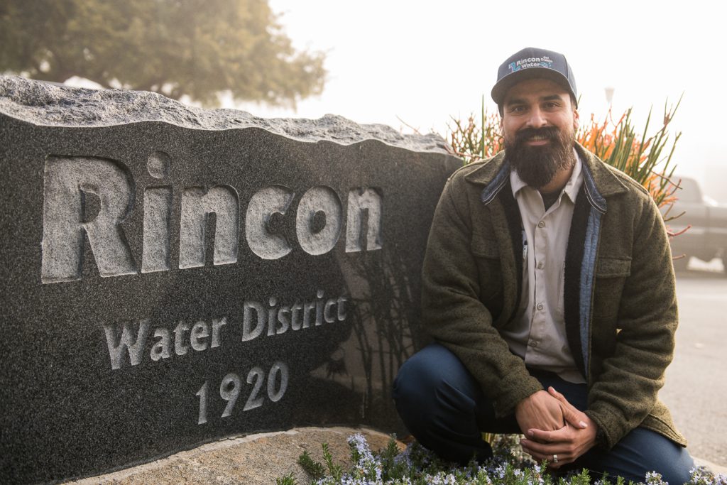 Palomar student Josh Lomeli in front of a Rincon Water District sign