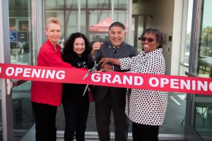 Palomar College officials and guests cutting the ribbon at the opening of the M&O complex