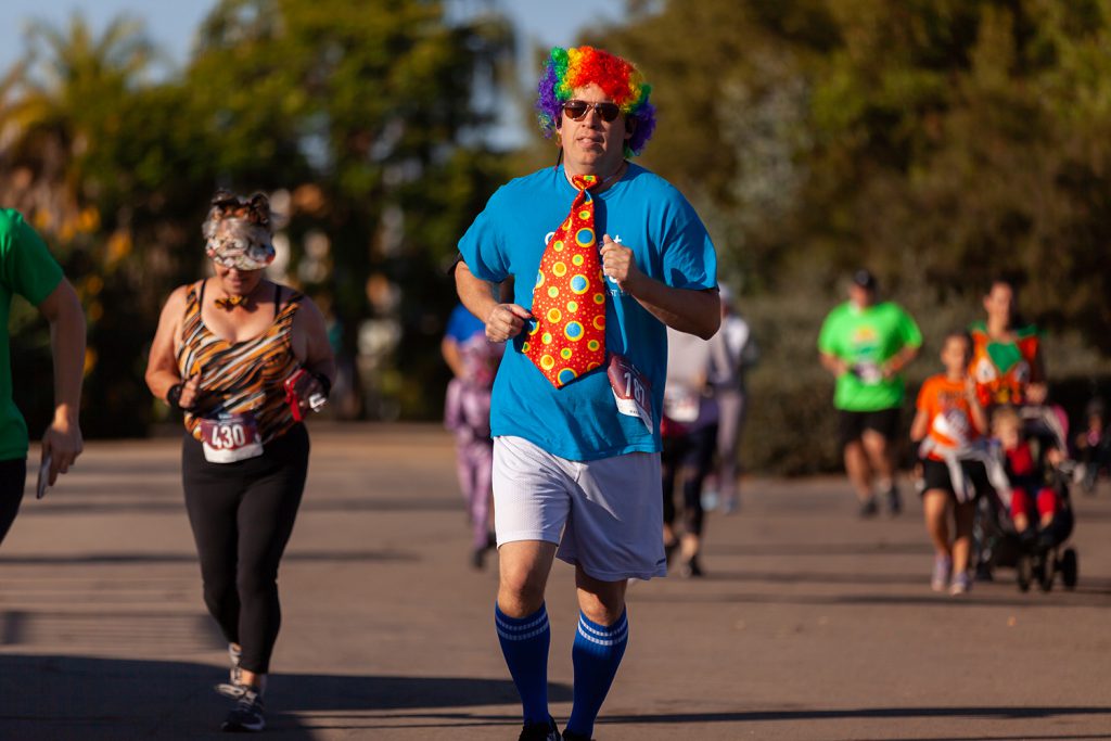 Runner dressed in a clown costume at the monster dash run/walk
