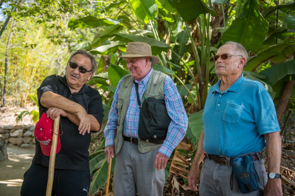 Three original arboretum contributors taking a tour of the property