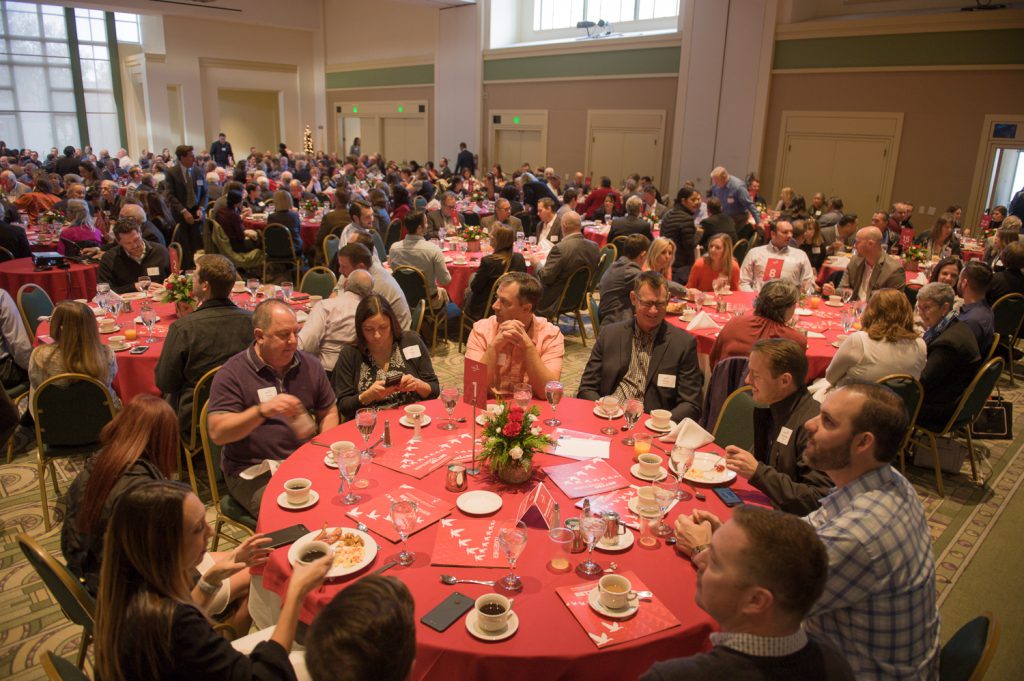 Banquet room filled with tables and attendees of the Palomar Community Showcase