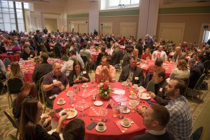 Banquet room filled with tables and attendees of the Palomar Community Showcase