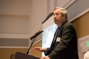 Recipient of Palomar's 2019 Comet award standing at a podium