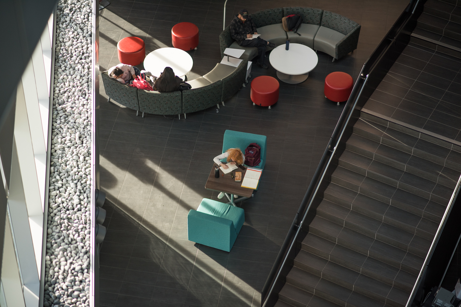 Students studying in the LRC building on campus