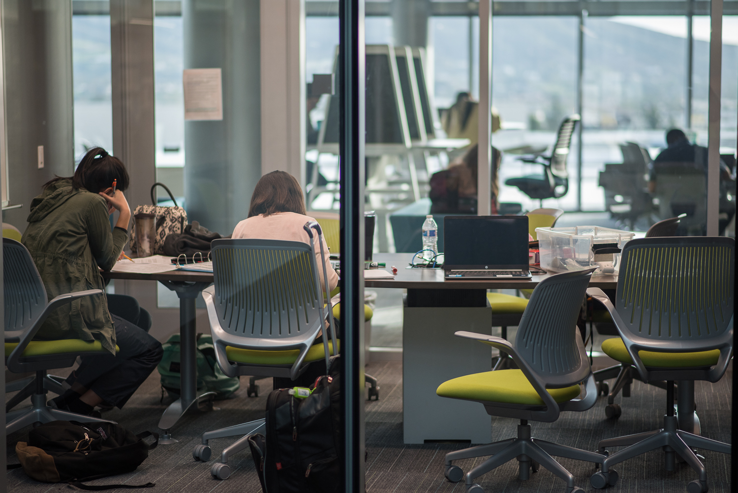 Two students studying at a table in the Learning Resource Center