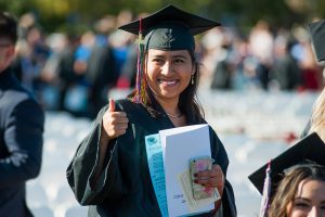 Graduate in cap and gown at the 2018 commencement ceremony