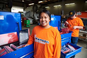 Jack Schwinkendorf and Sayra Martinez receive bright blue tool boxes filled with Snap-On hand tools