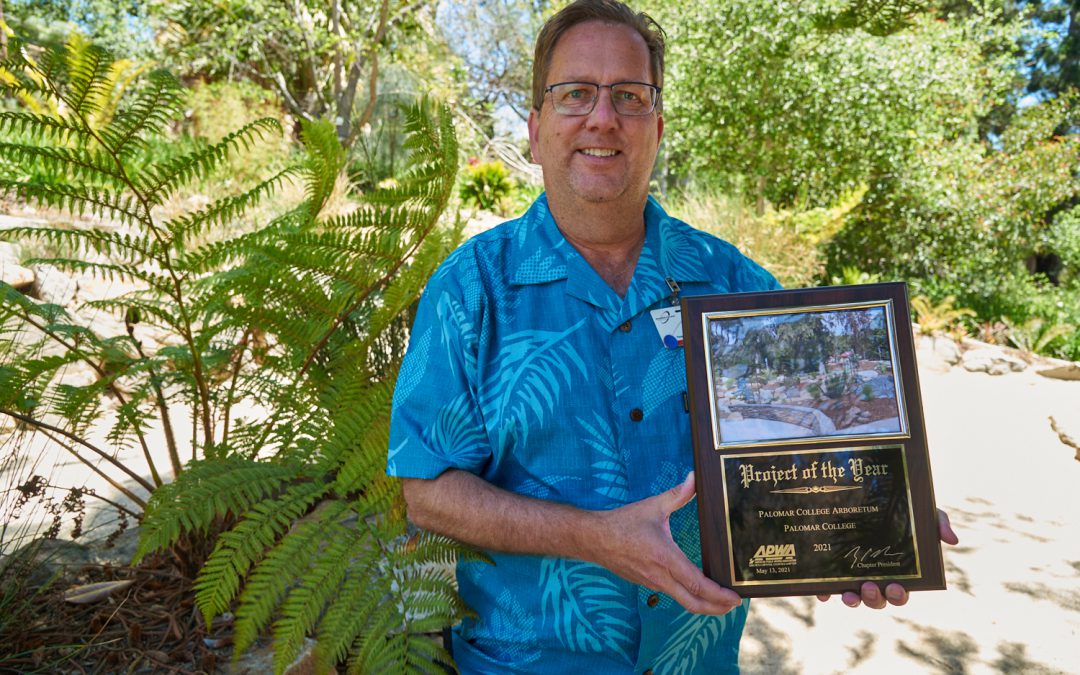 Dennis Astl holding the Palomar College Arboretum Award