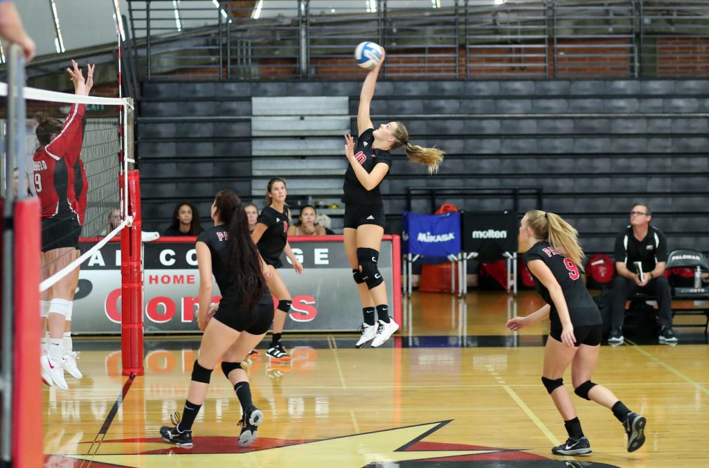 Palomar women's volleyball team playing game in the gym