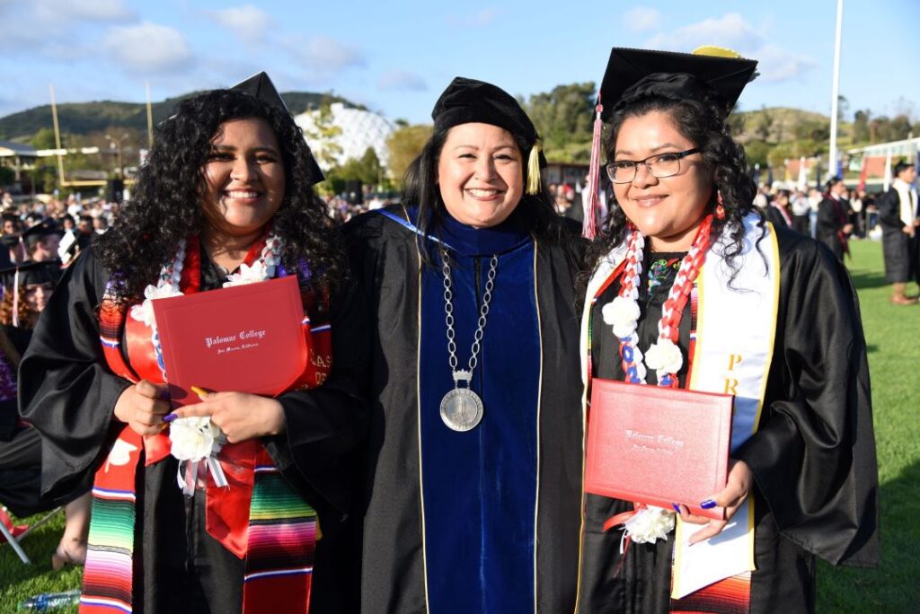 Dr. Rivera-Lacey with two Palomar Graduates
