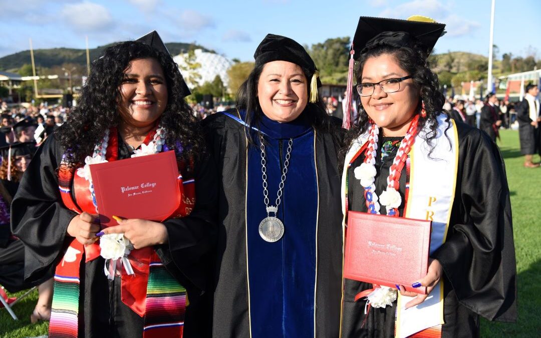 Dr. Rivera-Lacey with two Palomar Graduates