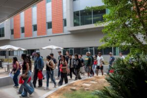 Palomar College students walking through the San Marcos campus