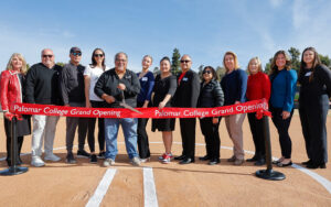 Administrators, faculty, Governing Board members, and community members cutting the ribbon at the Softball Stadium Grand opening on January 22, 2025.
