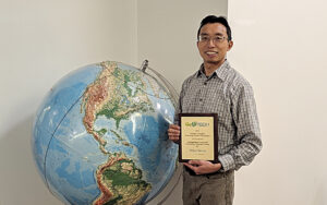 Palomar College Professor Wing Cheung holding recent award