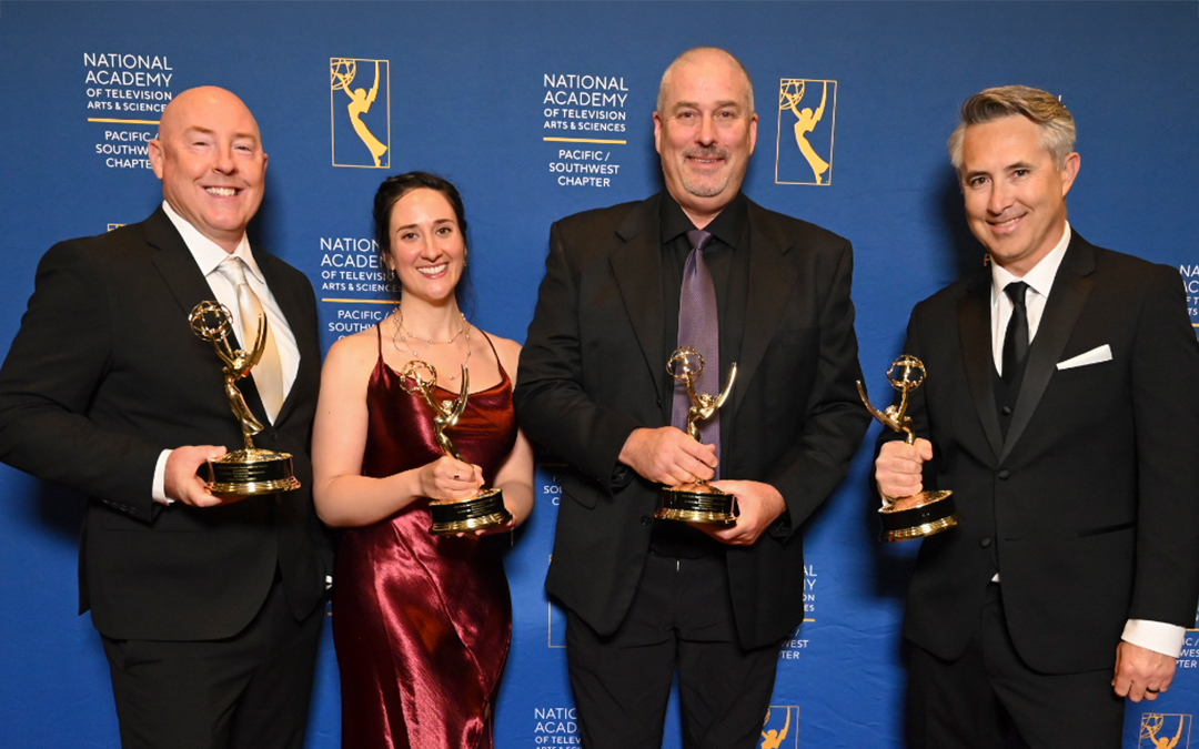 PCTV Employees pose with their emmy award for documentary film