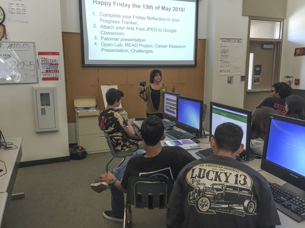 Donna talking film and darkroom classes with the students.