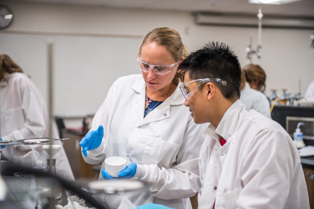 Two students in a chemistry lab