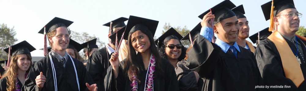 students in their cap and gown at commencement 