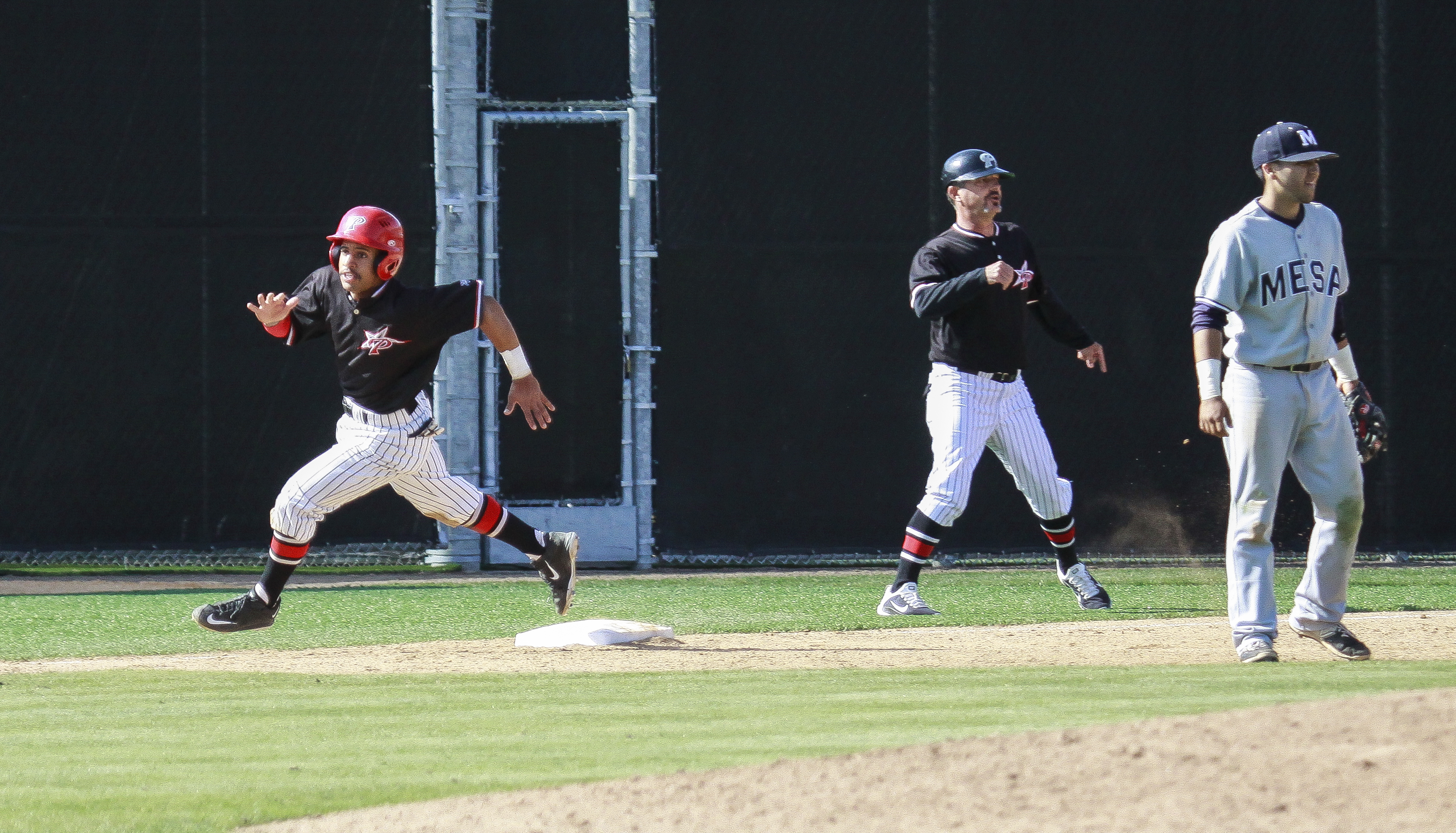 Palomar's Nashea Diggs rounds 3rd base on a 5th inning double by Chase Grant on March 22 against San Diego Mesa College at Palomar Ballpark. Diggs scored on the play putting The Comets ahead 8-4. Grant would score on a RBI by Mike Benson. Stephen Davis/The Telescope