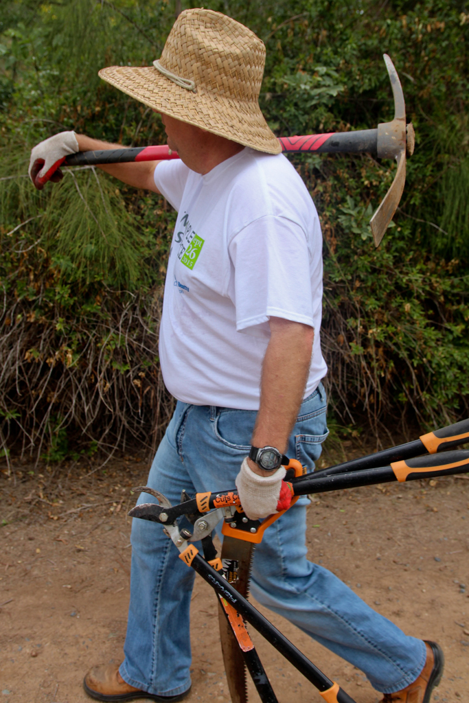 Dennis Astl, Palomar’s Manager of Construction Facilities, brings a pickaxe, saw and tree trimmers down to get to work at the Spring 2016 Arboretum Beautification Day on April 30. Michaela Sanderson/The Telescope