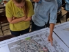 Ashley Brent and Samuel LaForest, STEM Ambassadors, look at a map of future plans for Palomar’s Arboretum at the Spring 2016 Arboretum Beautification Day on April 30. Michaela Sanderson/The Telescope