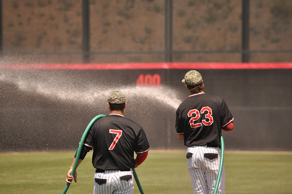 Palomar infielders Effrin Medina #7 and Niko Holm #23 prep the field before their home game againt Southwestern on April 21. Aaron Fortin/The Telescope