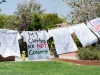 Shirts painted by Palomar College students hang on a clothesline in support of the No More Campaign, a quest to increase national awareness of domestic violence and sexual assault as well as unite the efforts of both movements to end gender-based violence. This was just a part of Palomar College's Career Day held at the Student Union on April 27. Tracy Grassel/The Telescope