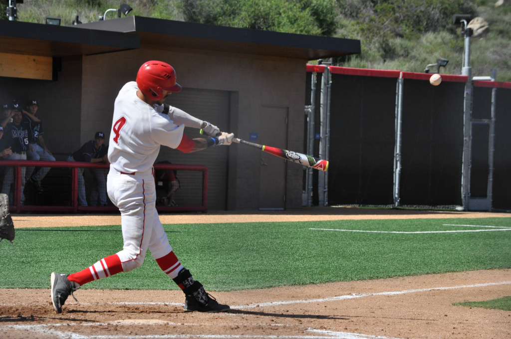 Palomar third baseman Niko Holm (4) launches one deep out of the park in the first inning for the Comets March 25 at the Palomar College Ballpark against. San Diego Mesa. Palomar would go on to win 9-3. Aaron Fortin/ The Telescope