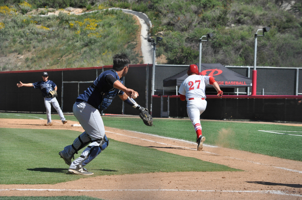 Palomar catcher John Mackay (27) lays down a bunt and ends up beating the throw to first to get on base March 25 at Palomar College Ballpark against San Diego Mesa. The Comets would go on to win 9-3. Aaron Fortin/ The Telescope