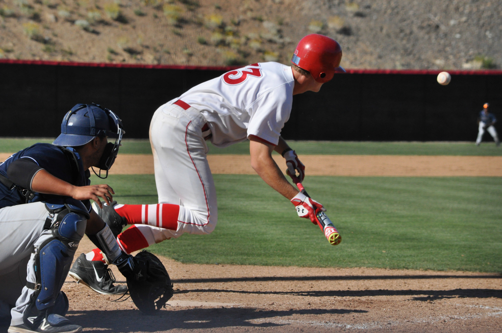 Palomar outfielder Cody Norton (33) makes good use of his one at bat laying a bunt down the first base line, beating the throw and ends up advancing all the way home to score a run March 25 at Palomar College Ballpark against San Diego Mesa. Aaron Fortin/ The Telescope