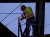 A construction worker spot welds pieces of the library together Aug 22. Christopher Jones/ The Telescope