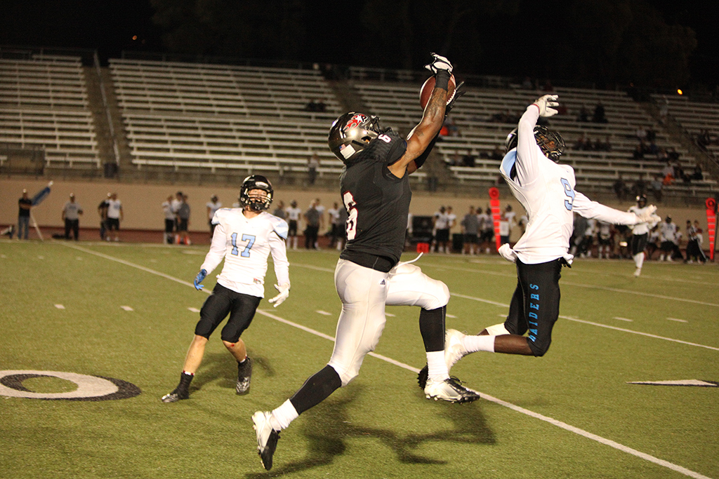 Palmer wide receiver Terrell Arnold (6) catches a pass for a gain of 42 yards, setting up another field goal in the fourth quarter on Sept. 24 at Wilson Stadium, Escondido High School. Bruce Woodward/The Telescope