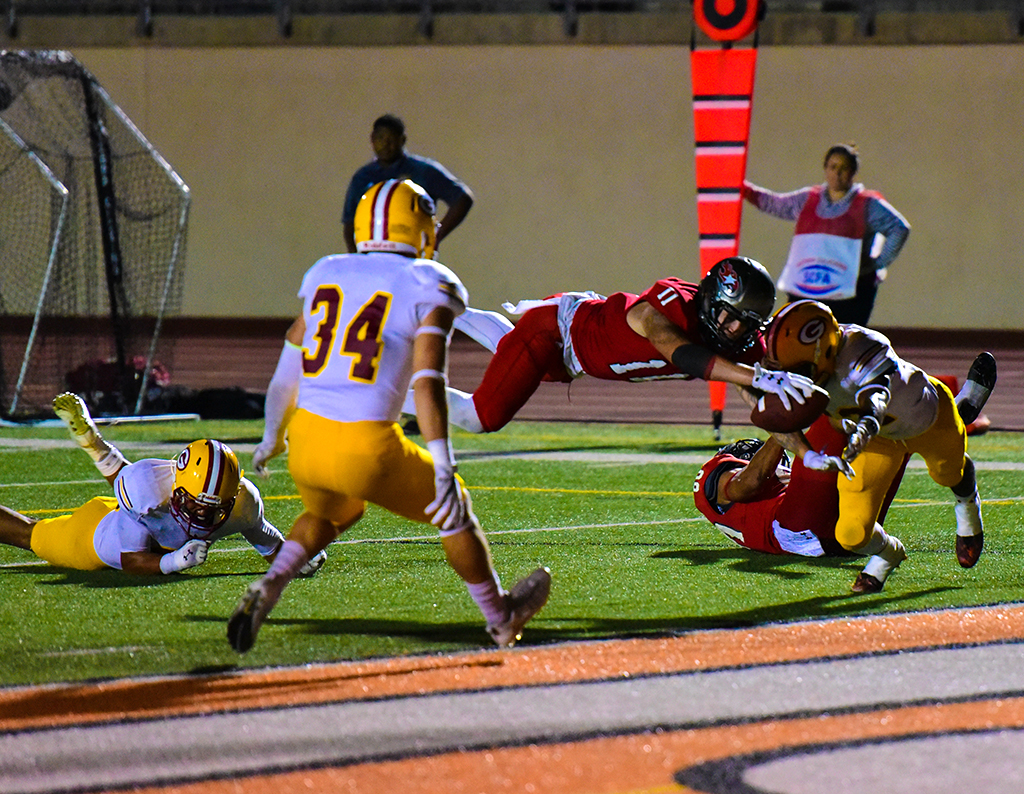 Palomar Johnny Arzola (11) dives for a touchdown to bring the comets score 27- 32 during Nov. 5 game against Saddleback at Wilson Stadium. Palomar was defeated by Saddleback 39-27. Johnny Jones/The Telescope