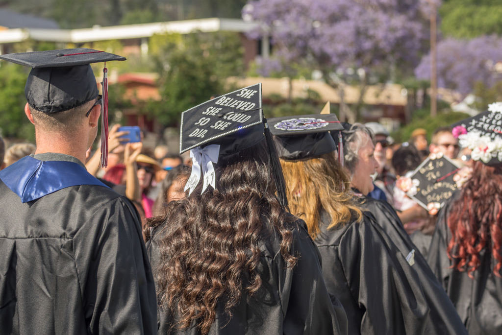 Graduating students file in with their decorated caps at Palomar's Commencement Ceremony at Palomar College in San Marcos, Calif. on May 26, 2017. Joe Dusel / The Telescope